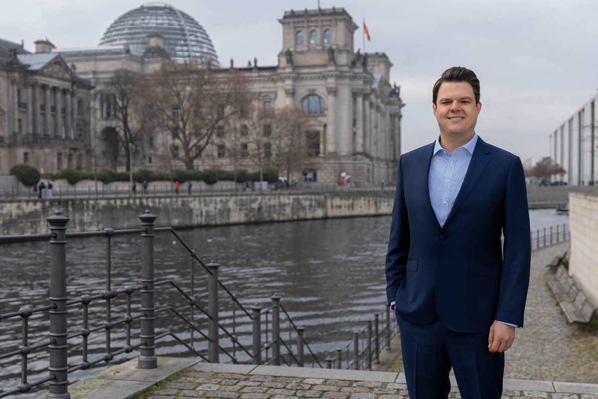Niko, our Head of Policy, in front of the Reichstag in Berlin on the banks of the Spree